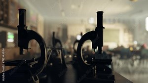 A school science lab with two microscopes on a table
