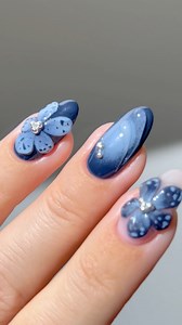 🌧️🌚🌸 fall nails that feel like a crisp autumn evening, with the deep blue hues and delicate florals 🌌 *products used are linked on my amzn in the bio _____ *affiliate #bluenails #darknails #fallnails #nudenails #nails #nailinspo #nailtutorials #diynails gray blue 3D nails flower nails floral nails aura ombre gradient almond nails french tips #nailsofinstagram #nailsonfleek #nailsnailsnails #nailsoftheday | Heygreatnails