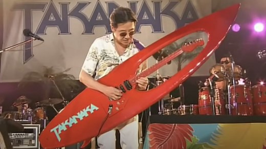 Watch Japanese fusion legend Masayoshi Takanaka shred on an awe-inspiring surfboard guitar