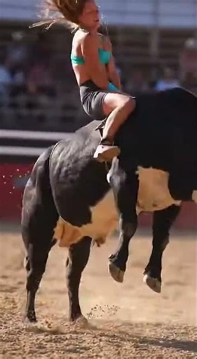 Vintage Sports Video: Girl in Daisy Dukes Riding a Bull at a Rodeo