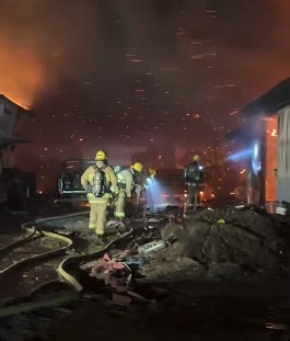 Firefighters battle structure fire in Santa Paula amid high winds