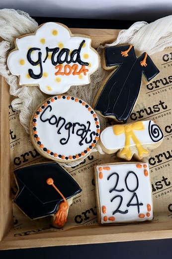 Graduation season calls for some tasty treats, and our handmade sugar cookies are just the ticket! 🍪 🎓 Say congratulations with a set of six delicious decorated sugar cookies! Show your graduate just how proud you are of them by shipping a 6 pack of iced sugar cookies. 🔗 shop.crustandbeyond.com/product/iced-cookie-gift-sets/. | Crust - a baking company