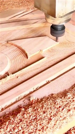 process of using a CNC router to precisely cut and engrave complex patterns into a wooden board