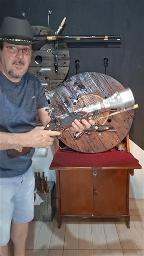 Non-functional examples of blunderbuss, muzzle-loading pistol, and flintlock pistols include: bac...