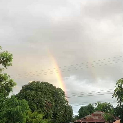 Double Rainbow Over a Scenic Rural Landscape