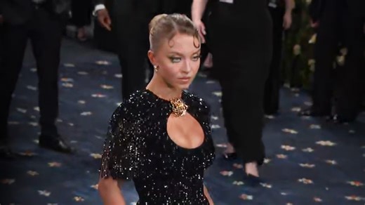 Sydney Sweeney shimmers on the 2025 Met Gala red carpet in a black beaded dress. | Entertainment Tonight