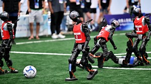 Robots sprint, box and play football at first World Humanoid Games
