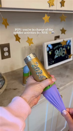 Nattie Jo Powell on Instagram: "For all my moms, who need an EASY & fun toddler activity on NYE!!🤝🪩✨ These DIY Party Poppers are low prep & so fun! Supplies needed: - empty paper towel roll tube or toilet paper tube - balloons - masking or paint tape (whatever you have on hand!) - pom poms or other confetti filler! 🌟 It’s actually easier to tie your balloon first, trim off half and attach the open end to the tub instead of what I did! (Oops pregnancy brain😅) Such a fun toddler activity/craft