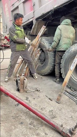 Heavy Duty Truck Repair: Mechanics Fixing a Broken Chassis