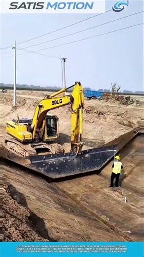 Lowering Large Metal Form Into Trench With Controlled Excavator Motion