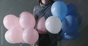 Pregnant Mom Shaking White Blue Pink Colored Balloons Happy to Be Expecting Baby. Revealing Gender Boy or Girl Announcement at Baby Shower Stock Video