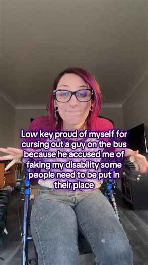 Story time later I had left the store early cause I was at an 8 for pain and he made me so mad I forgot I was in pain VD: lake is a feminine person with vivid red hair and black thick framed glasses wearing a grey and red sweater with Jeans and sitting on their rollator, there is on screen text that says “low key proud of myself for cursing out a guy on the bus because he accused me of faking my disability some people need to be put in their place” #disability #chronicpain #cripplepunk #ehlersda