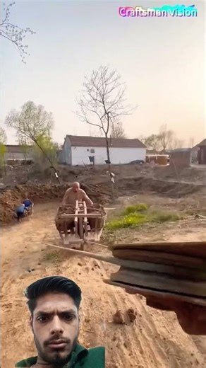 River dredging tips: Single-wheel wooden cart traction method for soil transport on steep slopes