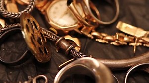 Gold jewelry consisting of chains and rings, close-up