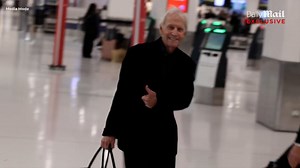 Paul Hogan, 85, looks healthier after arriving from US in wheelchair