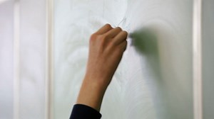 Student Standing At Blackboard Writing With Stock Footage SBV-312575220 - Storyblocks