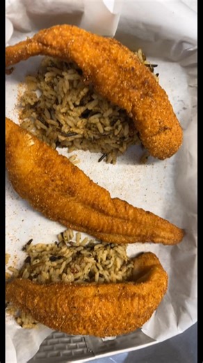 Some beautiful wild rice topped with some delicious mouthwatering catfish soaked in lemon then breaded and fried to perfection! @highlight #foodlover #comfortfood #seafood | Zachary Cox