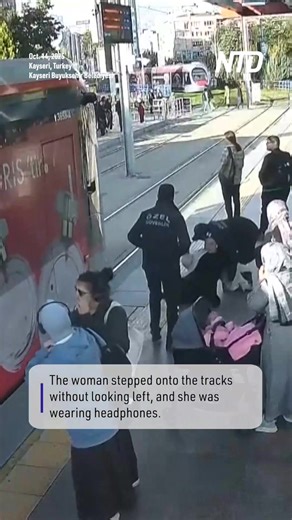 2.9M views · 19K reactions | A security guard has earned a commendation for saving a woman from being hit by a streetcar after she stepped onto the tracks in Kayseri, Turkey, on Tuesday. | NTD News | Facebook