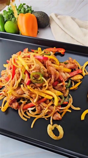 Sizzle up dinner in under 30 minutes with these Sheet Pan Chicken Fajitas from the Test Kitchen! A bold, one-pan meal that’s easy, healthy, and full of flavor! Full recipe here: https://womenoftoday.com/sheet-pan-chicken-fajitas/ | Women of Today By Camila Alves McConaughey