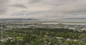 Burlingame California Aerial v2 panoramic panning view capturing charming easton addition neighborhood with leafy streets, sfo airport with san francisco bay views - Shot with Mavic 3 Cine - June 2022