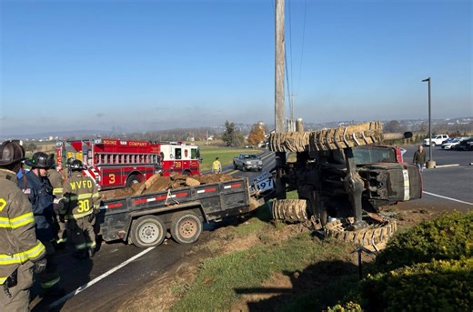 PHOTOS | Farm tractor crashes, overturns while hauling stones in Lancaster County