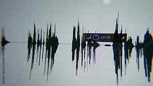 Audio wave post production correction process closeup. Audio waveform timeline on screen.