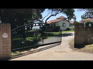 Massive driveway gate closes easily in heavy winds with Liftmaster CSL24UL gate operator
