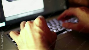 man typing in his laptop high speed