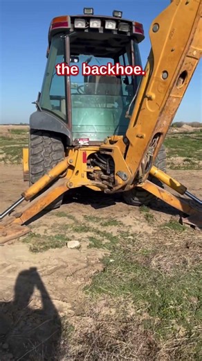Digging up some broken wires with the backhoe.