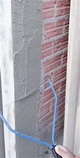 This is one way to level cement using simple tools, as done by a builder.