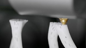 3D plastic printer in operation. 3D printing from white filament.