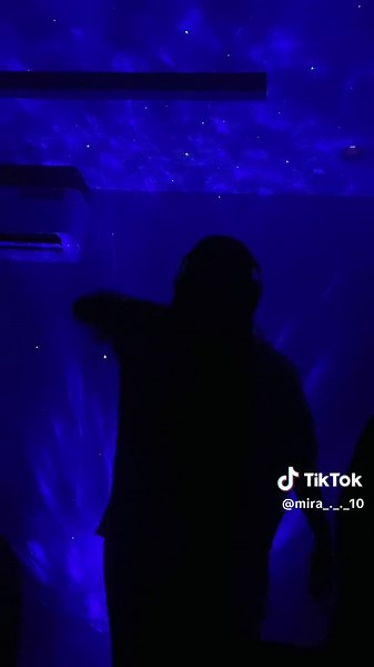 Dancing Under a Starry Galaxy Light Projection