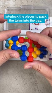 Interlock the pieces to pack the twins into the tray. #puzzlesolving #puzzles #puzzle #puzzlemaster | Puzzle Master Inc.