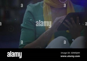 Woman tapping tablet causing orbs, scrolling smartphone exploring edtech network nodes in library. Technology, innovation, connectivity, digital, learning, communication, futuristic Stock Video Footage - Alamy