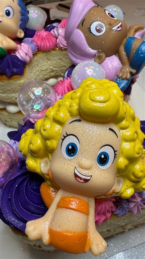 daisy 🌼 | custom cake designer |📍DC, MD, VA on Instagram: "this Bubble Guppies number cake was so fun to create! I absolutely love the ideas that my customers bring to me, especially when they allow me creative control over the design 🥰 #DaisyBakedIt #HomeBaker #DMV #Cake #Cakestagram #Instacake #DMVCakes #BaltimoreCakes #DMVBaker #DCCakes #MarylandCakes #MDCakes #BirthdayCake #CustomCakes #CakeDesign #Buttercream #CakeReels #CakeDecorating #BakersofInstagram #CakesofIG #CakeInspo #CakeOfTheD