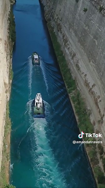 The Corinth Canal is a man-made waterway in Greece that connects the Gulf of Corinth with the Saronic Gulf in the Aegean Sea. It's situated about 50 miles (80 kilometers) west of Athens. Construction of the canal began in the late 19th century and was completed in 1893. The canal cuts through the narrow Isthmus of Corinth, which historically served as a vital shipping route, enabling vessels to avoid the lengthy and perilous journey around the Peloponnese peninsula. This engineering marvel has a