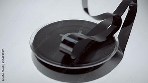 On the coil VHS the magnetic tape falls on it in large quantities. Closeup. Slow mo, slo mo, slow motion, high speed camera, 240fps, 250fps