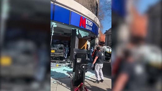 Cash machine stolen after Range Rover smashes into a bank in London