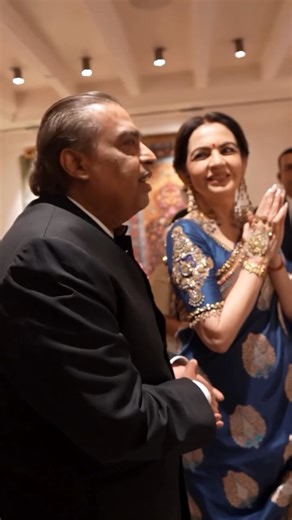 Reliance Industries Limited on Instagram: "At the Decembering evening, Mrs. Nita Ambani and Mr. Mukesh Ambani were presented with a remarkable portrait by Kal Baffi artisans Shri Rafiq Ahmad Sofi and Shri Shahnawaz Ahmad Sofi—a gift shaped by devotion and a year of painstaking artistry. The piece unites four rare techniques: 3D lotus work, embossed zari, single-tone shading, and walnut-wood carving. Faces rendered in pashmina, garments in silk, and a zari-woven backdrop together reveal 45 colour