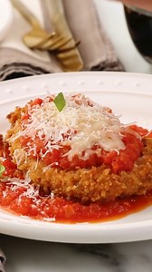 This crispy, cheesy, saucy pork cutlet parmesan is sure to be a dinnertime hit. Our recipe starts with pork tenderloin, which is sliced into medallions and pounded thin so it cooks in a flash. Get the recipe: bit.ly/4gLrftB | Martha Stewart