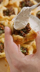 Need a Friendsgiving app everyone will remember? Get ready to be the center of the party with bite-sized Wellies that bring on the big, beefy flavor and elegant presentation of its full-size counterpart. Find the full recipe at CentralMarket.com | Central Market