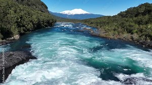 Petrohue River At Petrohue In Los Lagos Chile. Volcano Landscape. Sky Clouds Background. Los Lagos Chile. Todos Los Santos Mountain. Petrohue River At Petrohue In Los Lagos Chile.