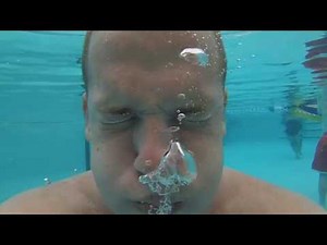 BLOWING BUBBLES UNDERWATER IN A POOL