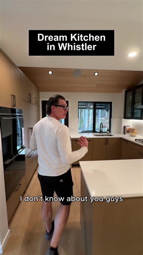 Check out this amazing kitchen layout that brings everyone together! Whether you're prepping meals or baking cookies, this grand staging area allows you to interact with your friends and guests while staying central to the action. The design creates a sense of togetherness, perfect for sharing moments with loved ones and fully immersing yourself in the Whistler lifestyle. The combination of natural textures, clean contrast, and warmth throughout the space captures the signature modern Whistler v