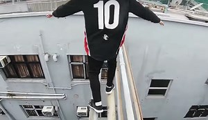 Death-defying video shows daredevils running from police