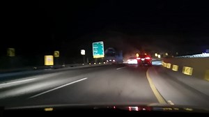 Nighttime Highway Drive Featuring Various Vehicles