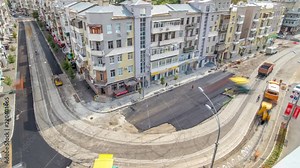 Asphalt paver, roller and truck on the road repair site during asphalting timelapse. Road construction equipment. Stock Video