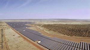 Large solar power plant in Africa using photovoltaic panels to generate power from the sun.