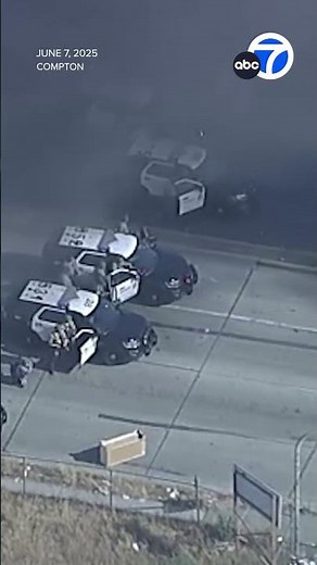 Car set on fire amid clash between protesters and federal agents in Compton