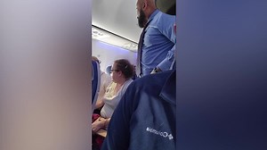 Angry passenger shouts about crying baby on his flight in viral video